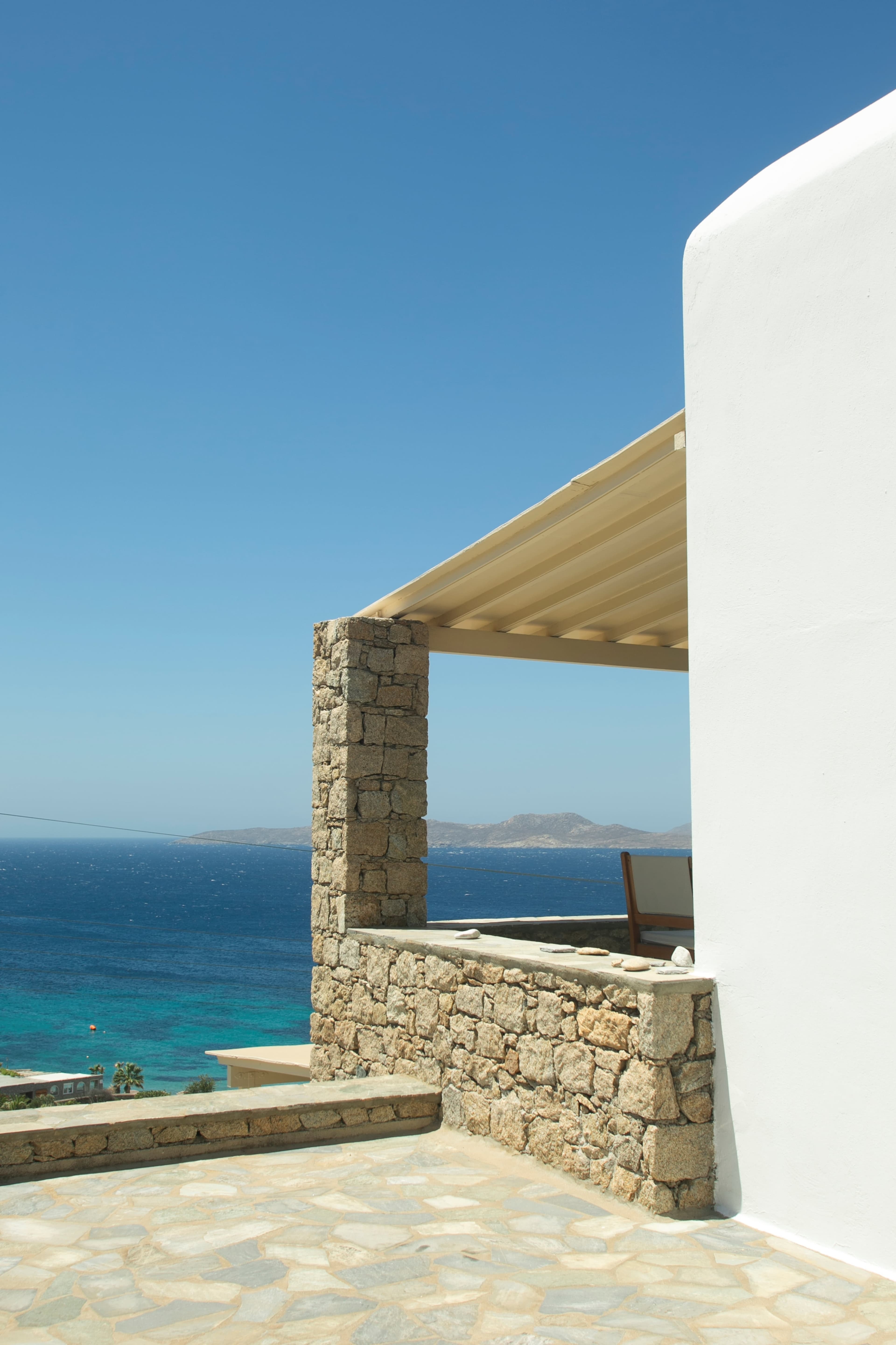 Stone terrace and canopy overlooking the sea