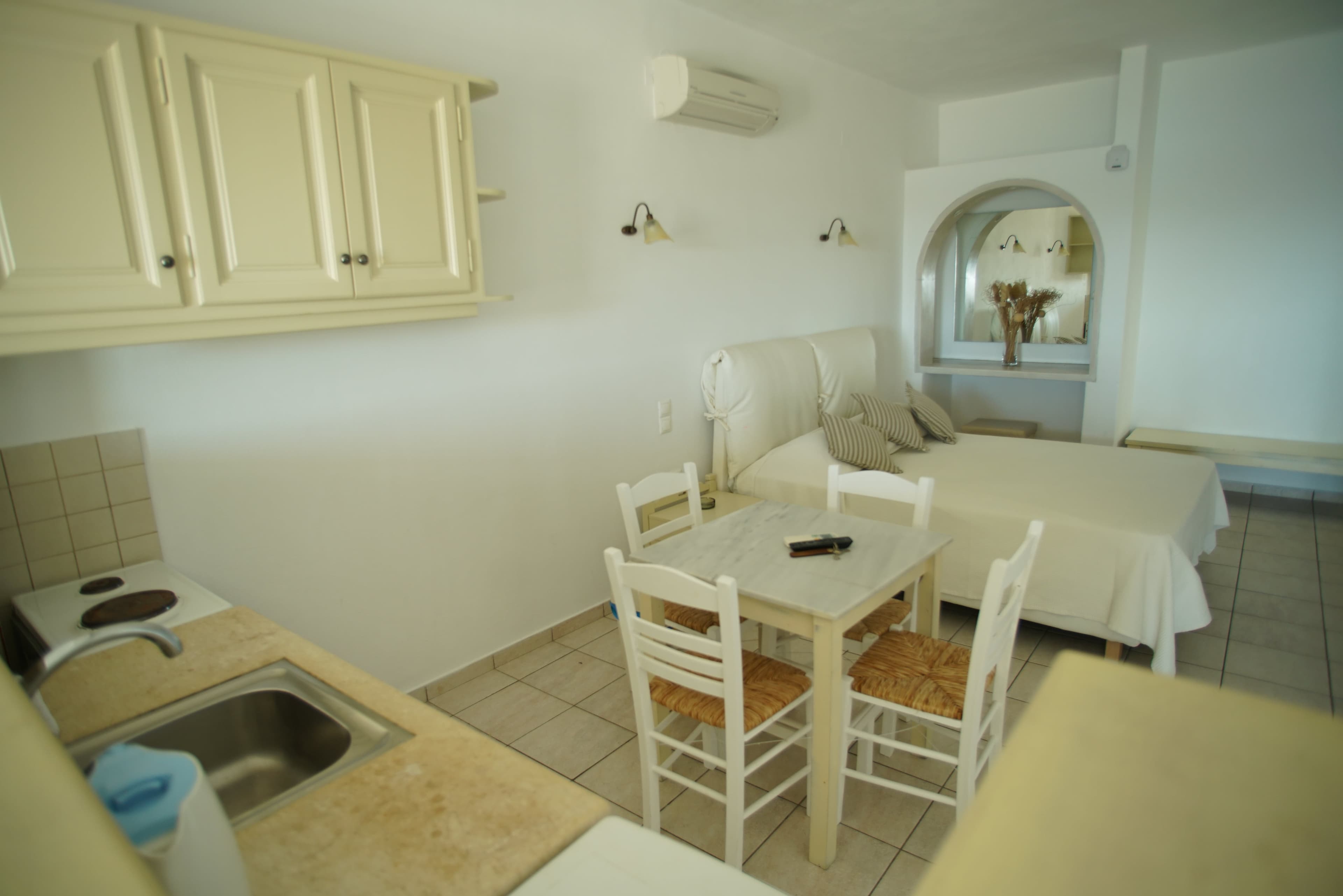 Kitchenette counter looking toward the dining table and beds